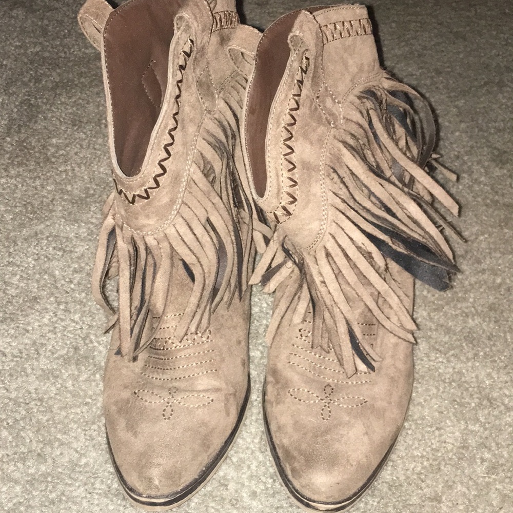 Brown tasseled boots.
